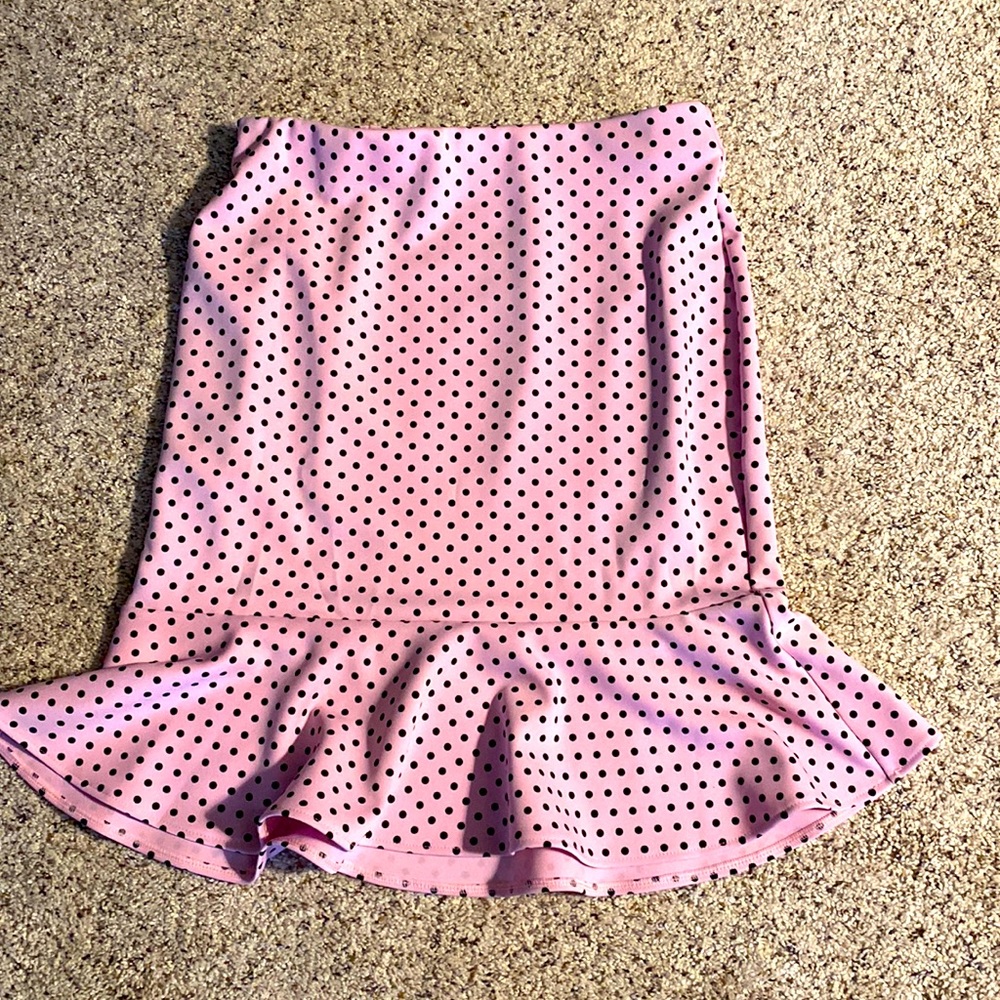 Flared pink and black poke a dot skirt. Never worn. Tags still attached